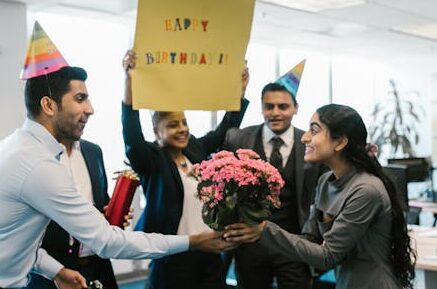 Woman at work receiving flowers for her birthday